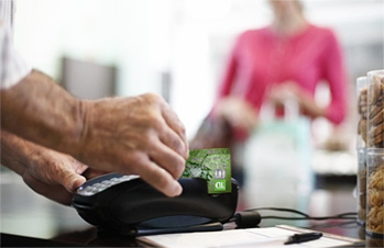 A merchant swiping a TD Credit Card