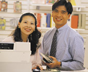 Image of couple by cash register